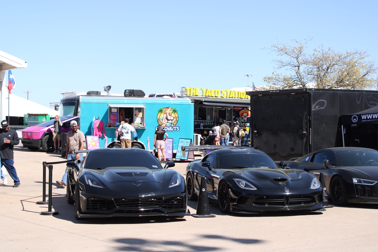 Black Corvette and Dodge Viper at a car event