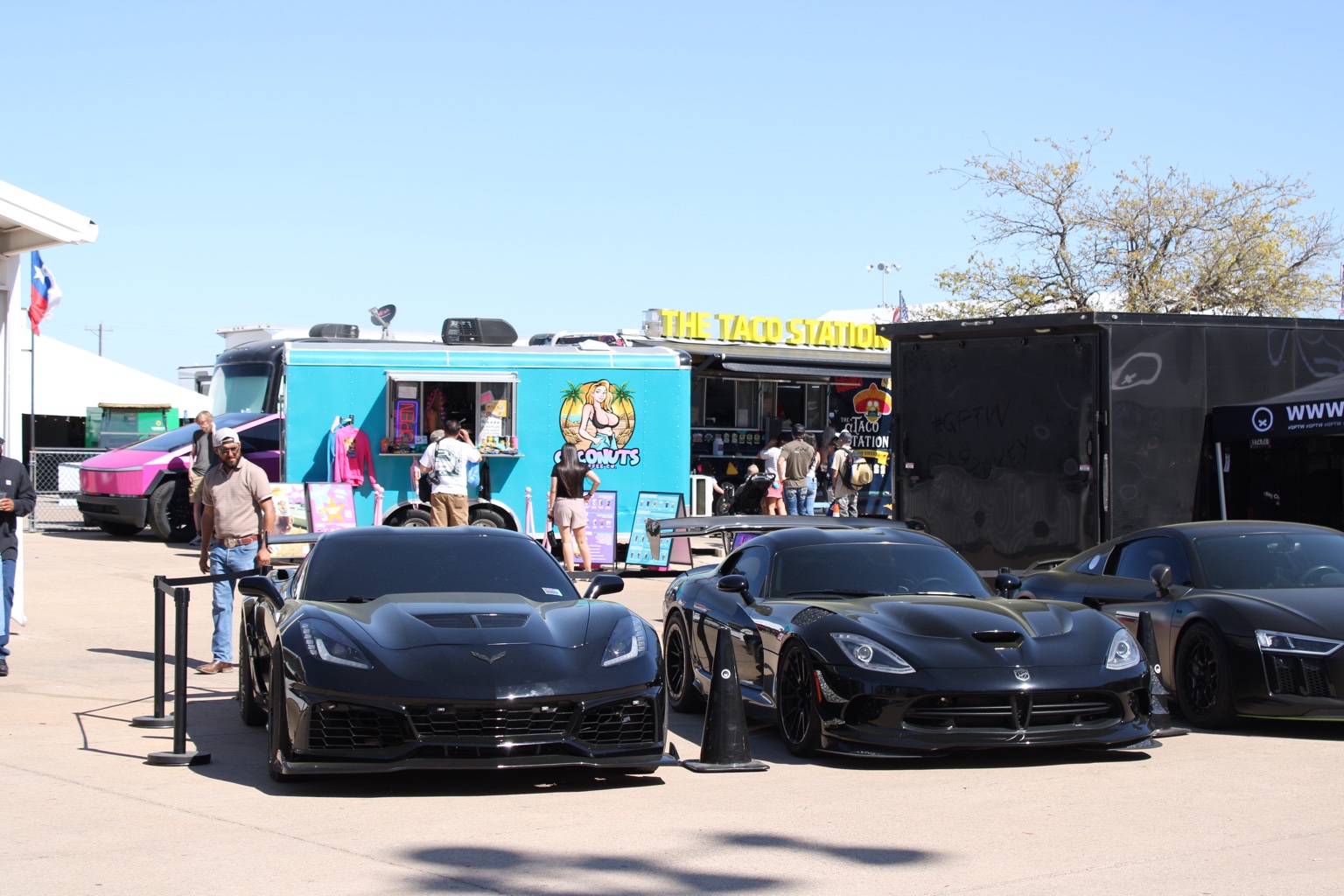 Black Corvette and Dodge Viper at a car event, alternate frame