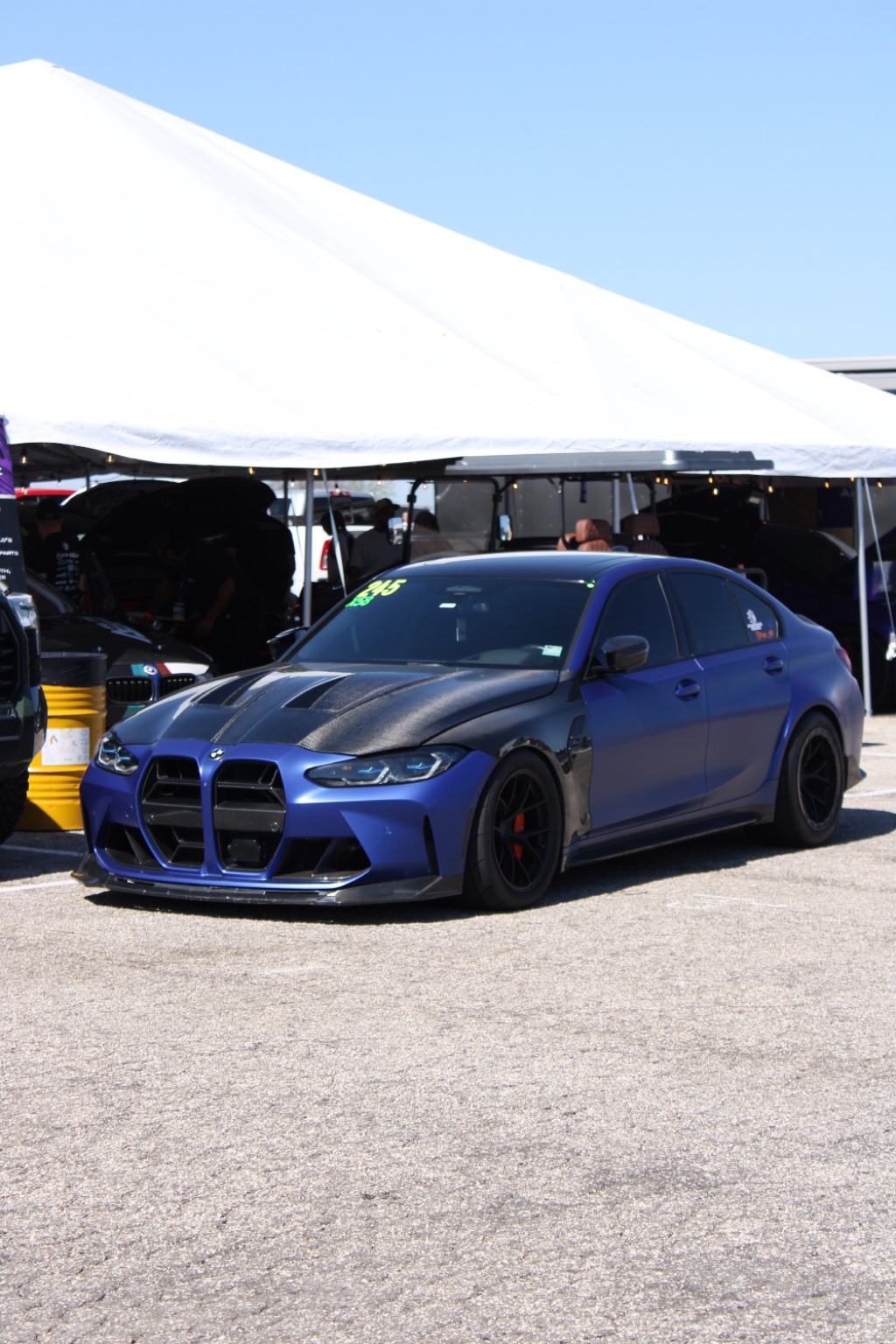 Blue BMW M3 at a performance car event