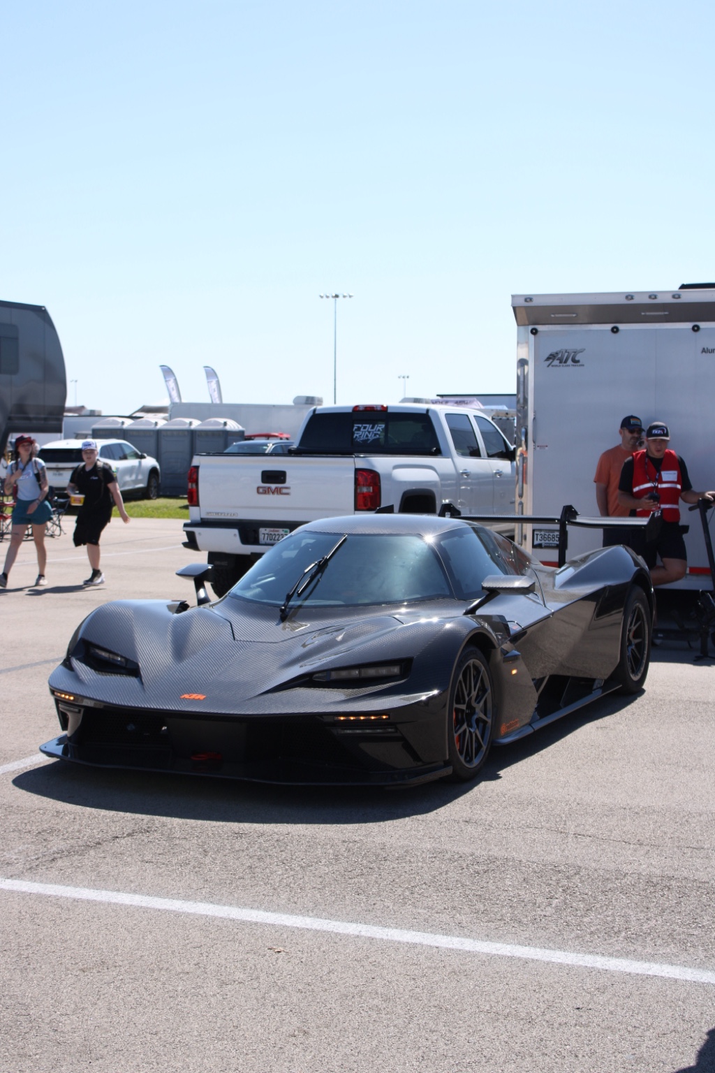 Angular carbon-fiber performance car at a show