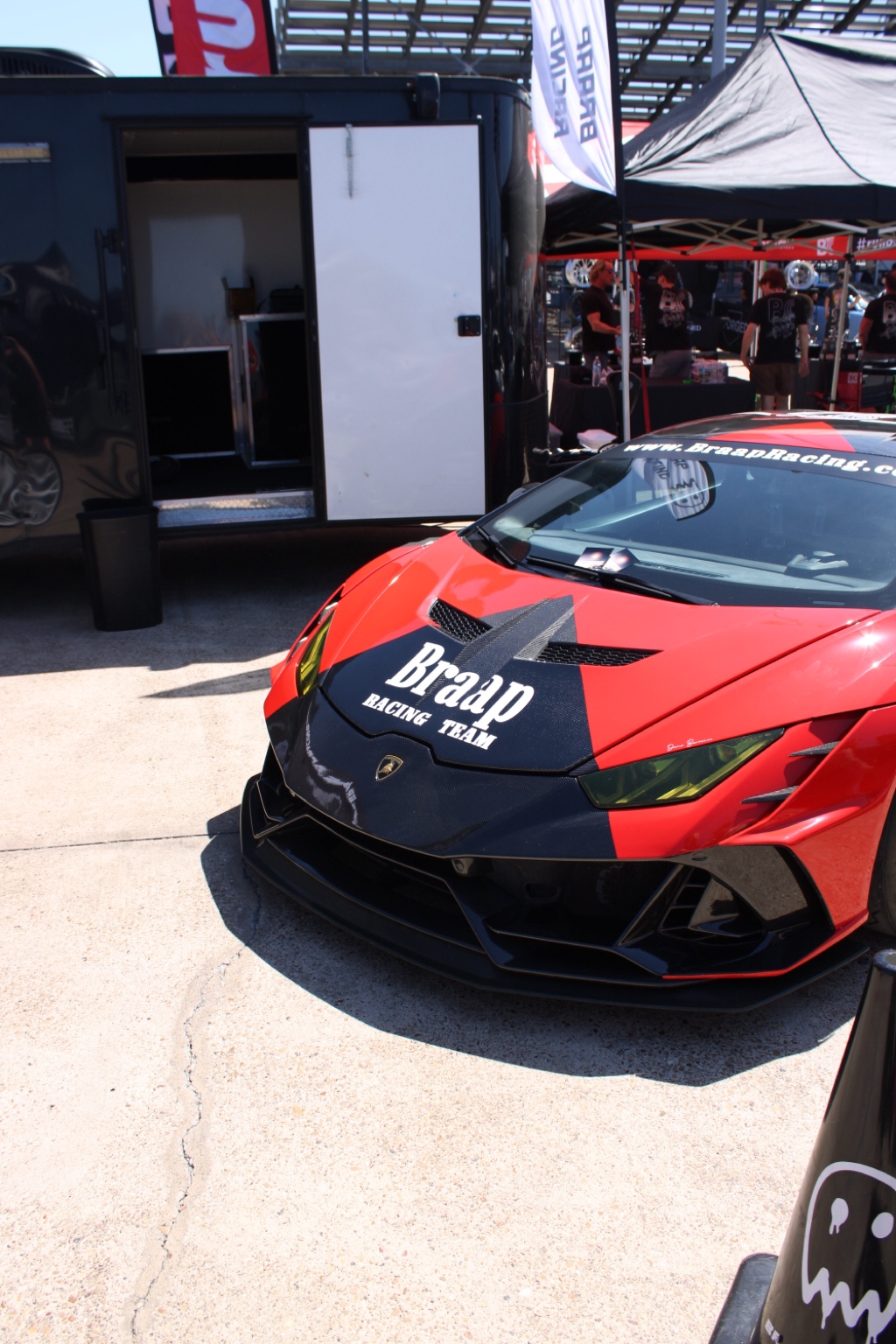 Red Lamborghini at an automotive event