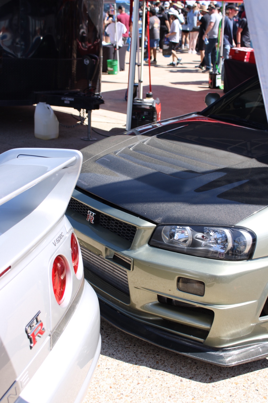 Close detail of a green GT-R and white GT-R
