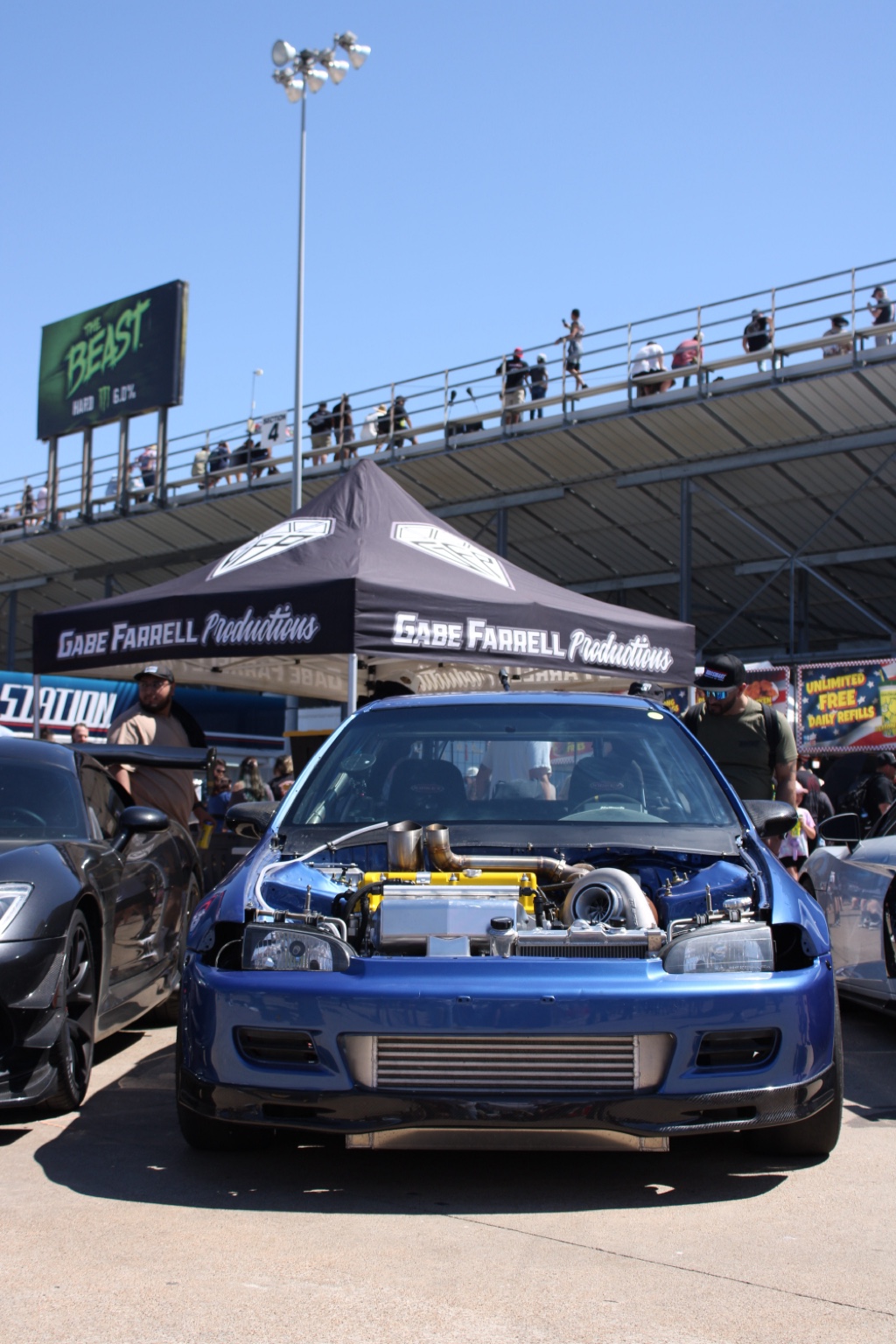 Blue modified car front view with exposed engine